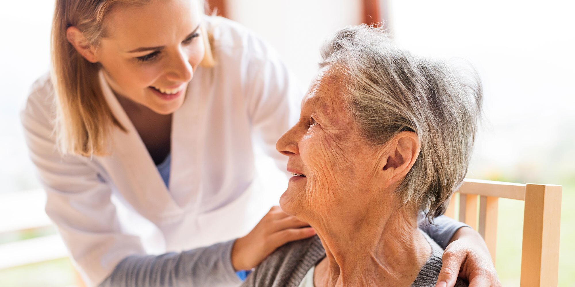 Nurse and a senior woman during checkup.