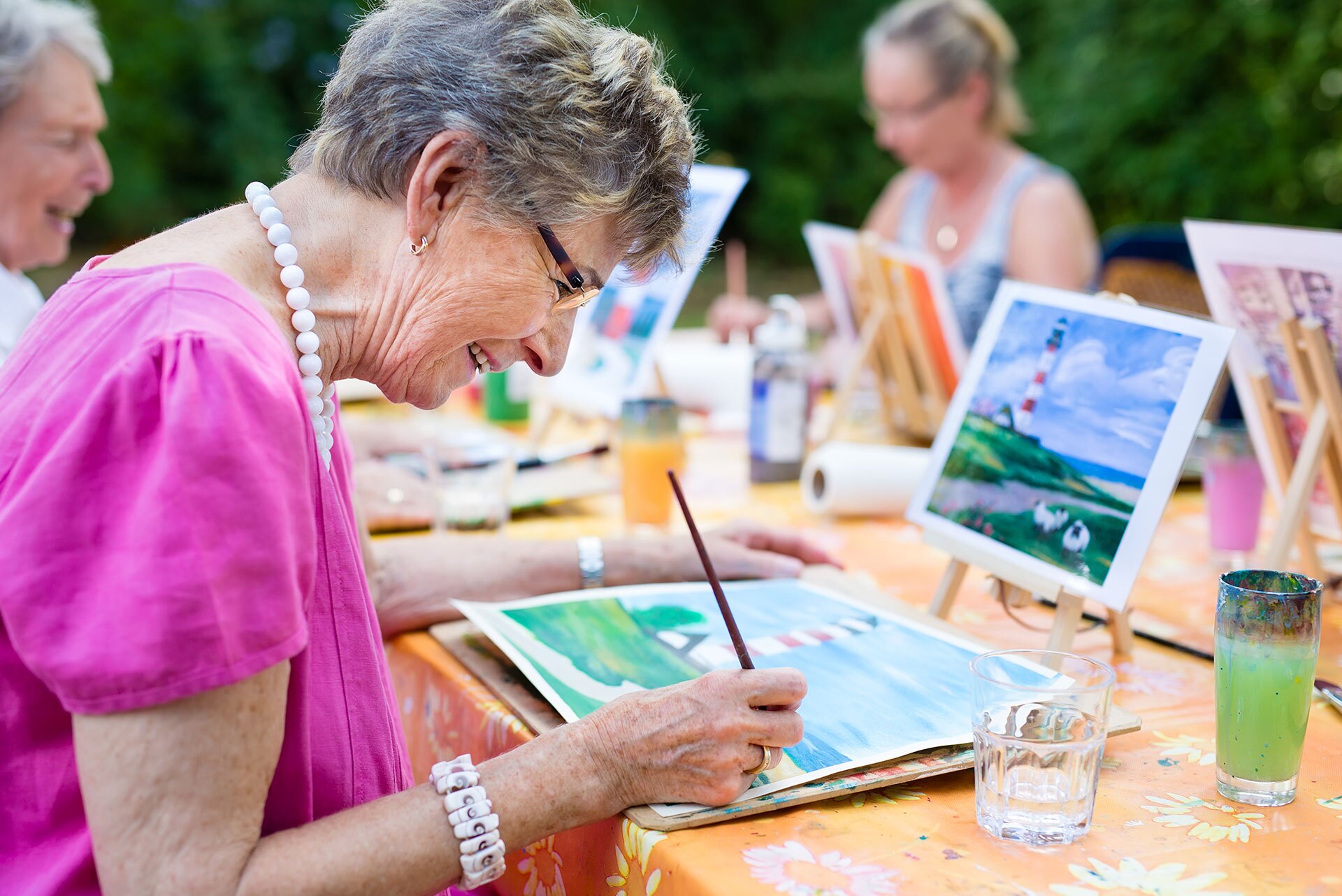 McKnight Place resident painting in watercolors.