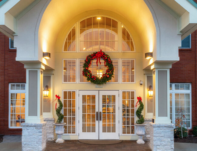 Front Entrance of McKnight Place Assisted Living and Memory Care decorated for the holidays.