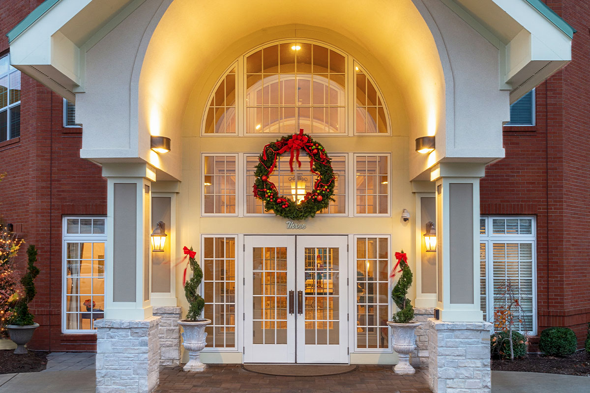 Front Entrance of McKnight Place Assisted Living and Memory Care decorated for the holidays.