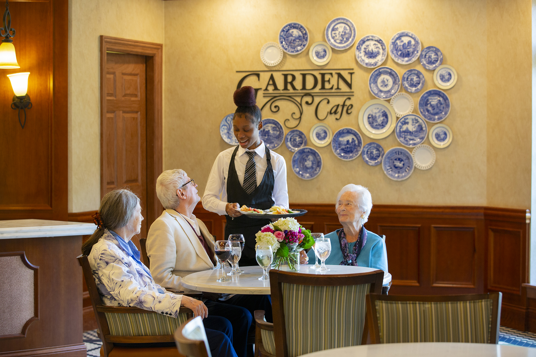 Residents enjoying the Garden Cafe at McKnight Place