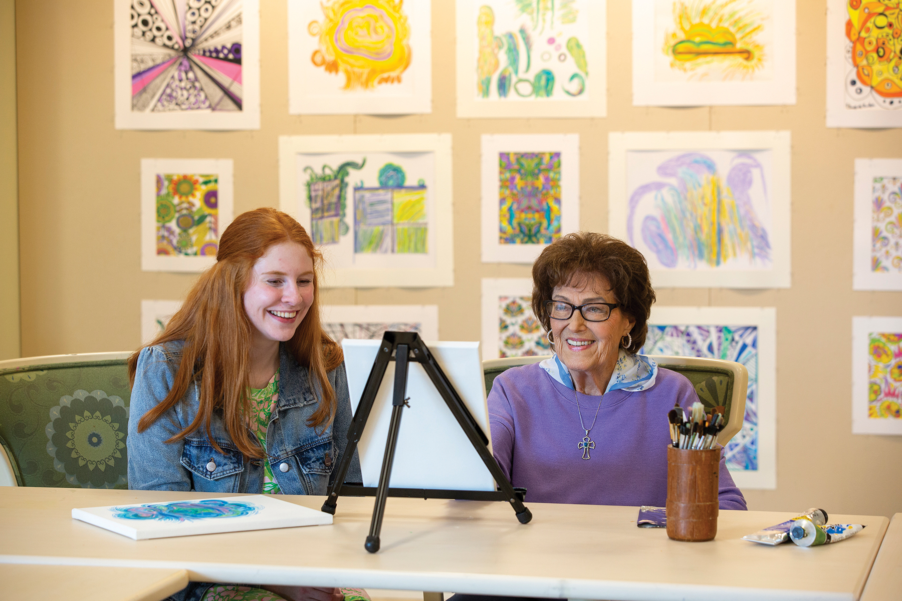 A caregiver visiting with a resident at McKnight Place