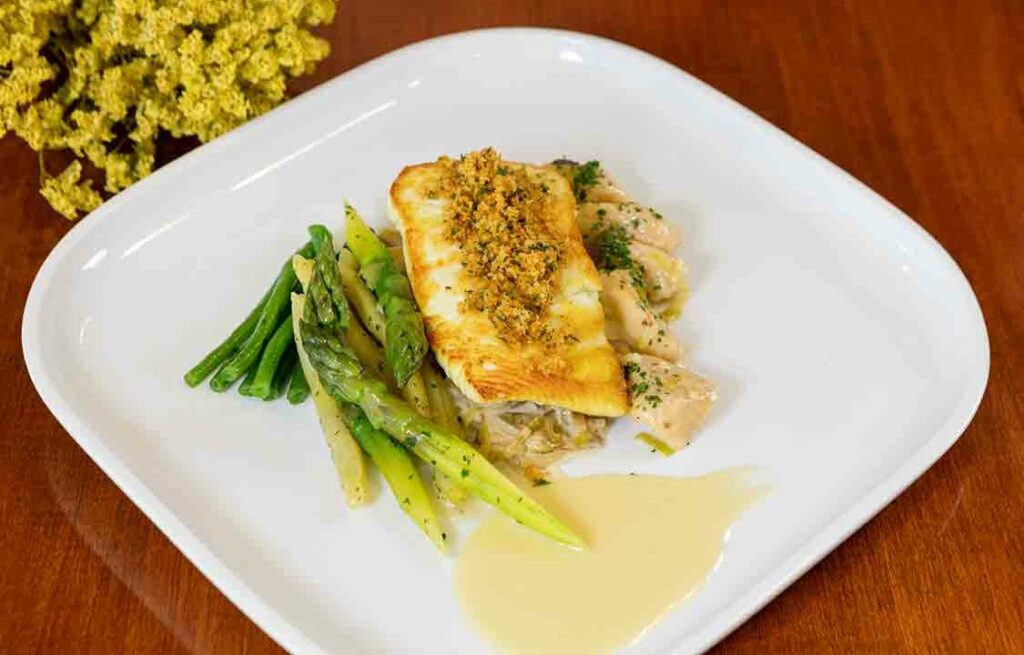 Pan-seared halibut plated at McKnight Place